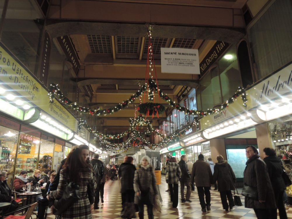 Arcade in Prague lined with shops and cafes| Laugh Travel Eat