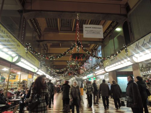 Arcade in Prague lined with shops and cafes| Laugh Travel Eat