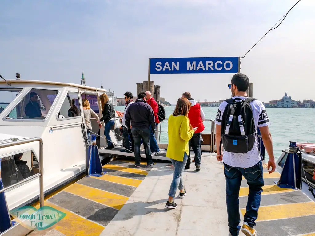 getting on boat for three island tour Venice Italy - laugh travel eat