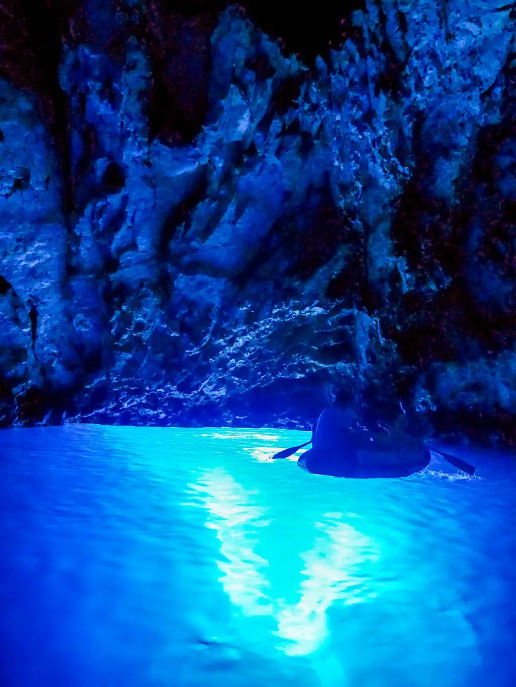 tourist boats inside split blue cave croatia