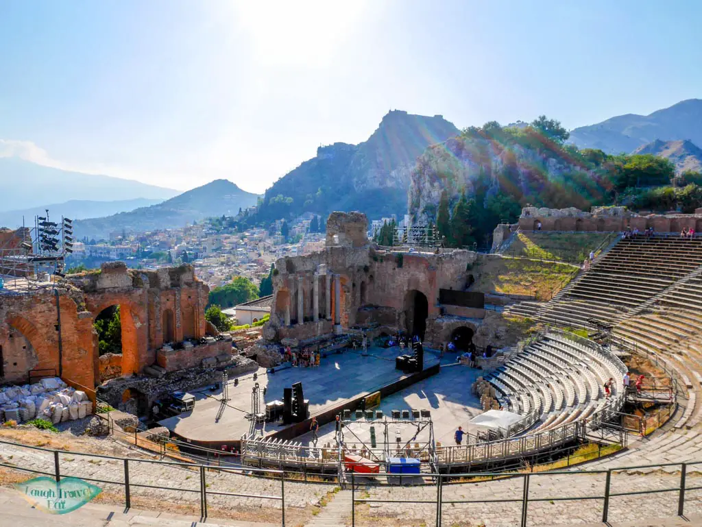 From the top of the Ancient Theater in Taormina, you get a good view of the theater, city and the mountains afar | Laugh Travel Eat