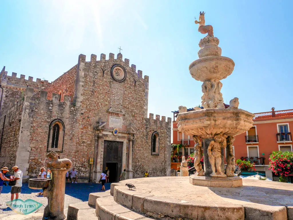 Square with a beautiful drinking fountain in front of the Duomo of Taormina | Laugh Travel Eat