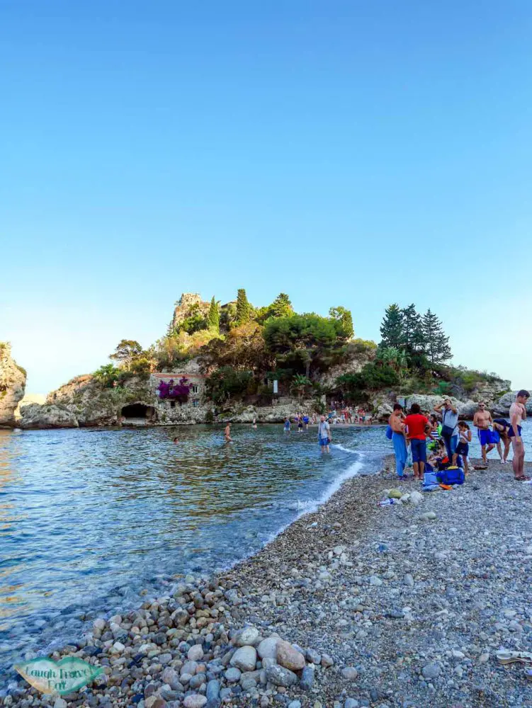 The narrow strand of sea that acts as a passage way from the beach at Taormina to Isola Bella | Laugh Travel Eat