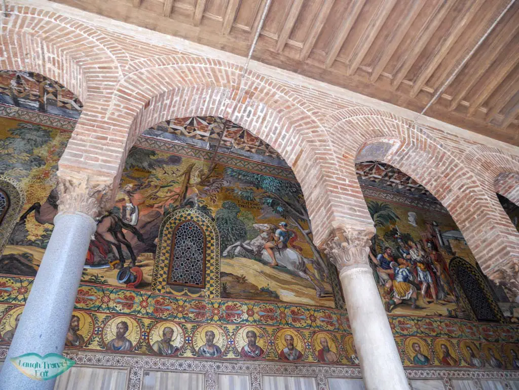 The colourful, detailed mural on the exterior of Cappella Palatina | Laugh Travel Eat