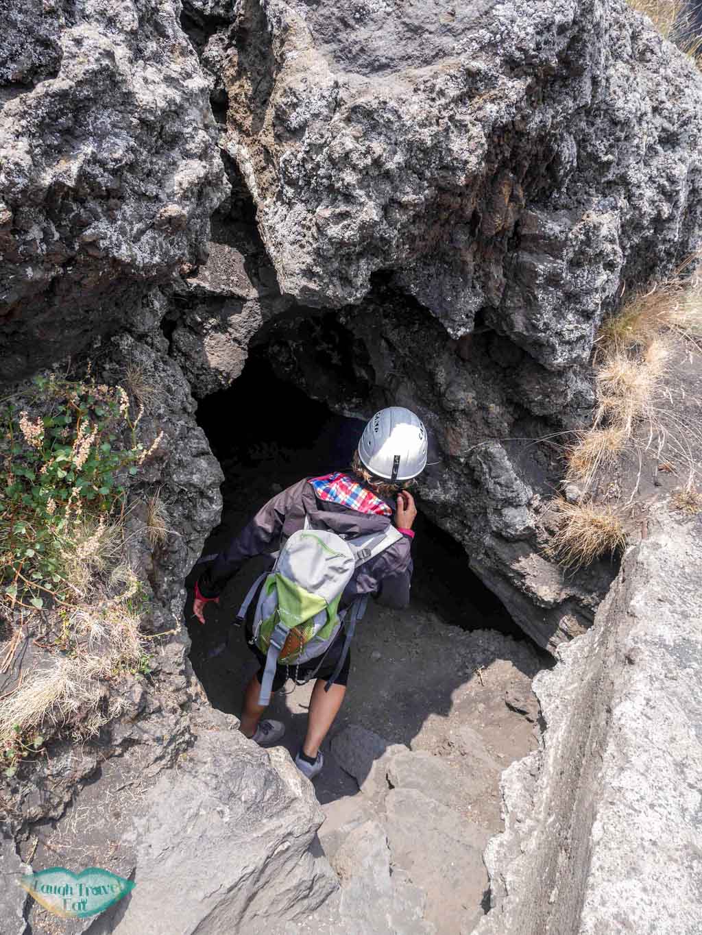 Heading into a lava tube cave on Mount Etna, armed with helmet and torch, Mount Etna, Catania, Sicily | Laugh Travel Eat