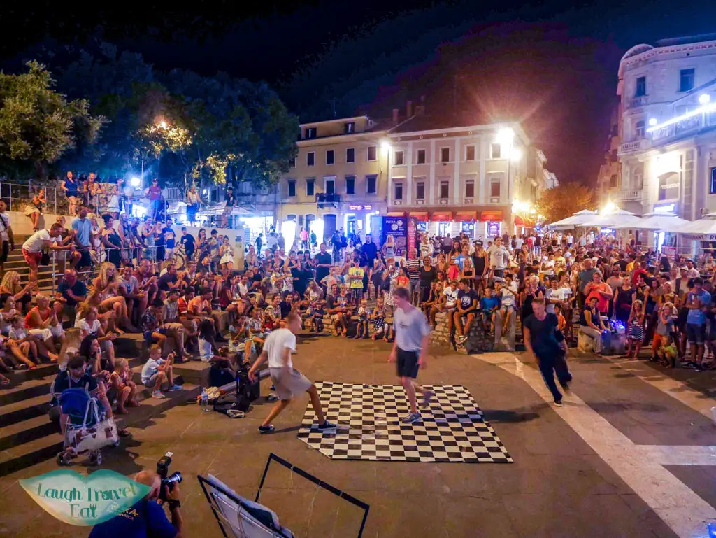 street-performance-outside-the-gate-of-the-triumphal-arch-of-sergius-Pula-Croatia-Laugh-Travel-Eat
