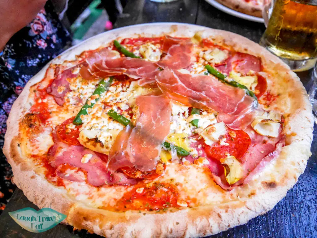 Massive-pizza-with-asparagus-ham-and-cheese-at-Pizzeria-Rustica-Bled-Slovenia-Laugh-Travel-Eat