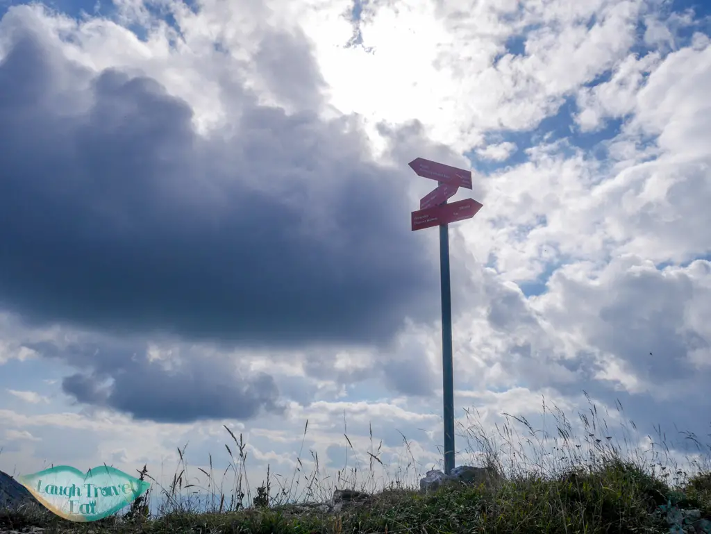 signposts atop trail mount vogel bohinj slovenia - laugh travel eat