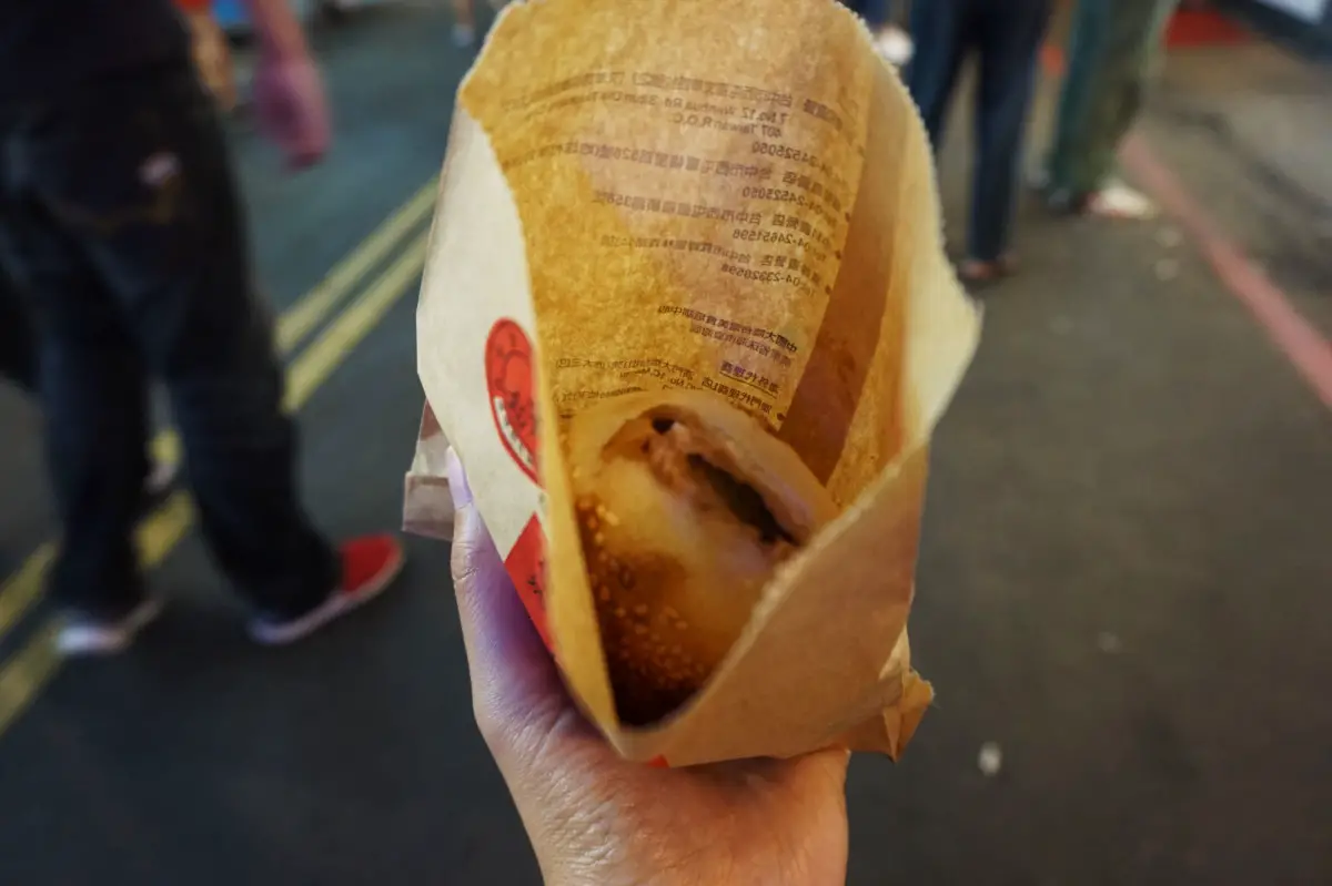 Pepper biscuit in a paper bag at FengJia Night Market, Taichung, Taiwan | Laugh Travel Eat