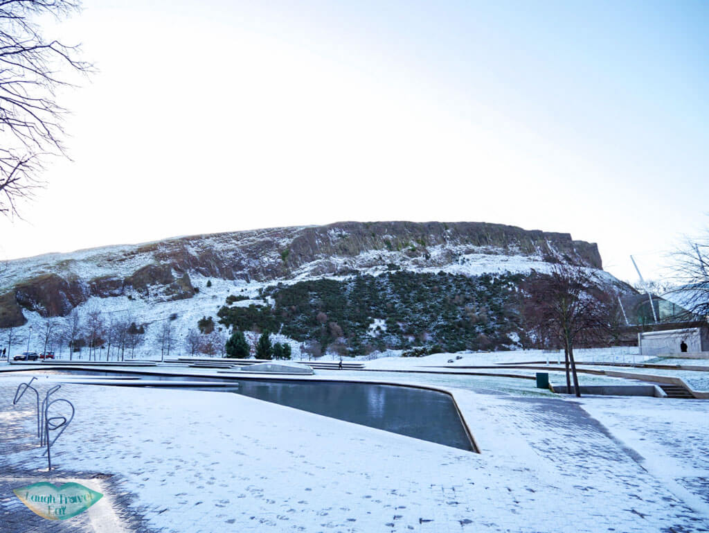 Arthur's Seat from the side in snow in Edinburgh, Scotland - Laugh Travel Eat