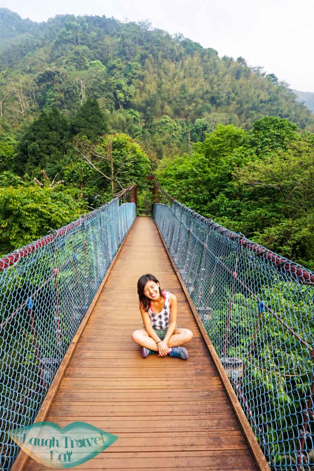 posing on the empty hanging bridge in Dasyueshan National Forest Recreational Area, Taichung - Laugh Travel Eat