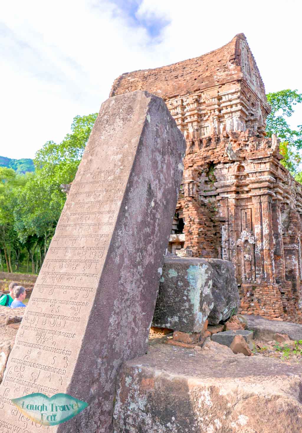 Fallen inscripted pillar in My Son, Hoi An, Vietnam - Laugh Travel Eat