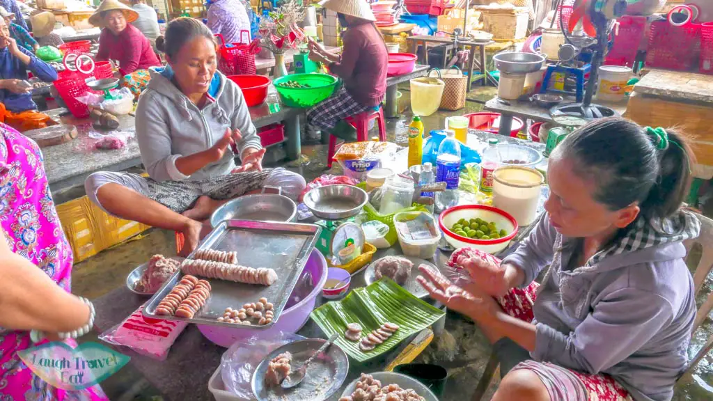 ladies at work in central market, Hoi An, Vietnam - Laugh Travel Eat