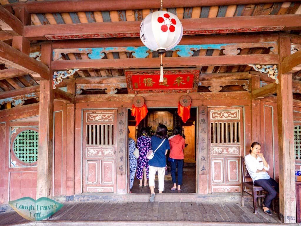 on Japanese bridge hoi an vietnam - laugh travel eat
