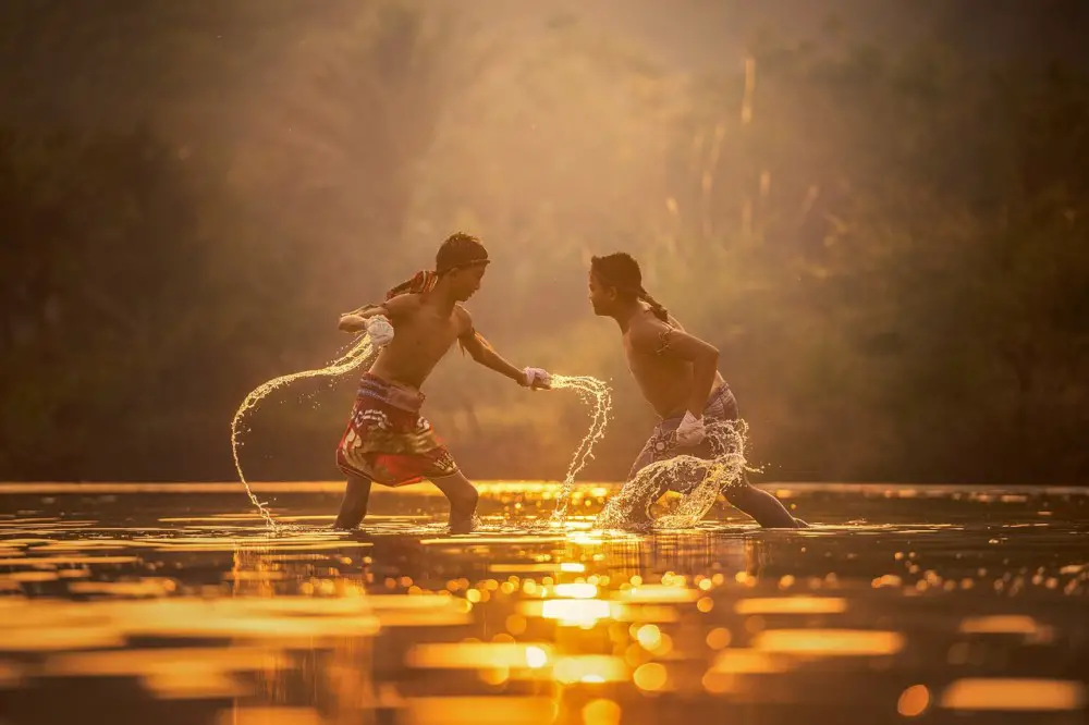 Boys fighting in the River