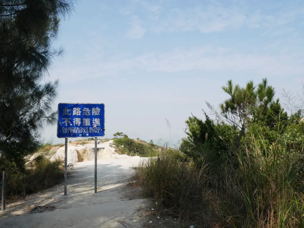 Danger sign in front of Pineapple Mountain, Tuen Mum, Hong Kong | Laugh Travel Eat