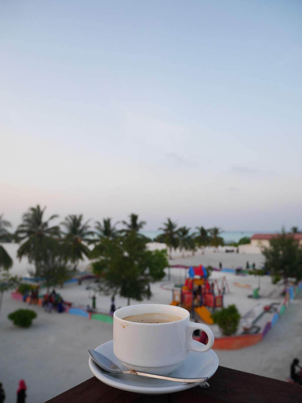 Coffee on top of island deck overlooking children's playground, Gaafaru, Maldives | Laugh Travel Eat