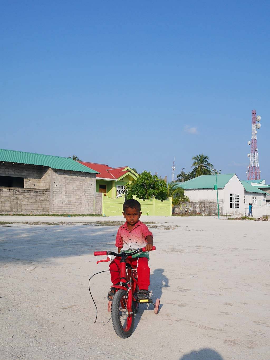 kid on a bicycle, Gaafaru, Maldives | Laugh Travel Eat