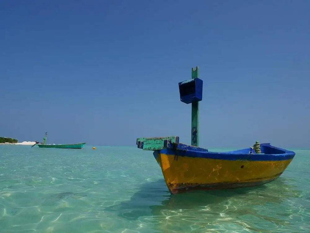Wooden fishing boat on the bikini beach of Gaafaru, Maldives | Laugh Travel Eat
