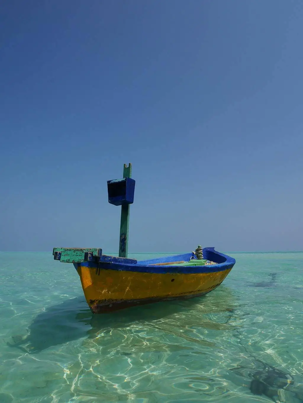 Maldives fishing boat in the blue sea, Gaafaru, Maldives | Laugh Travel EAt