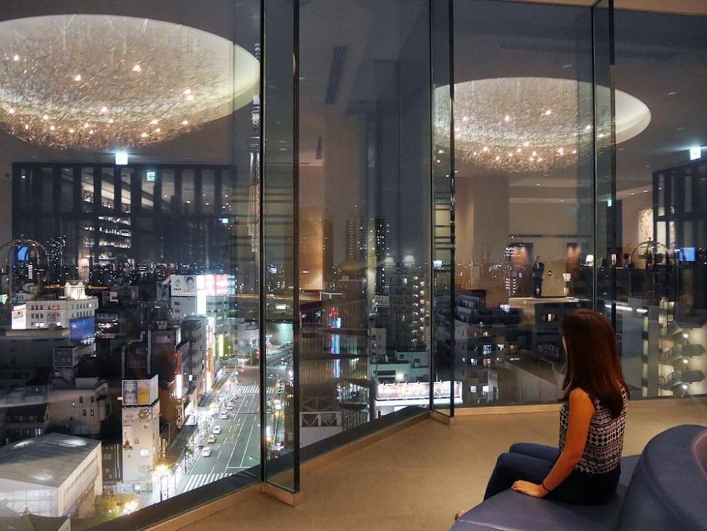 My sis admiring the nightsky of Asakusa from the lobby of the Gate Hotel Kaminarimon, Asakusa, Taito, Tokyo, Japan | Laugh Travel Eat