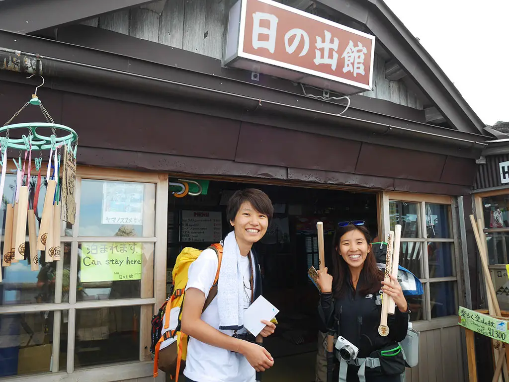 getting wooden stick stamps on at Mount Fuji huts, Japan | Laugh Travel Eat