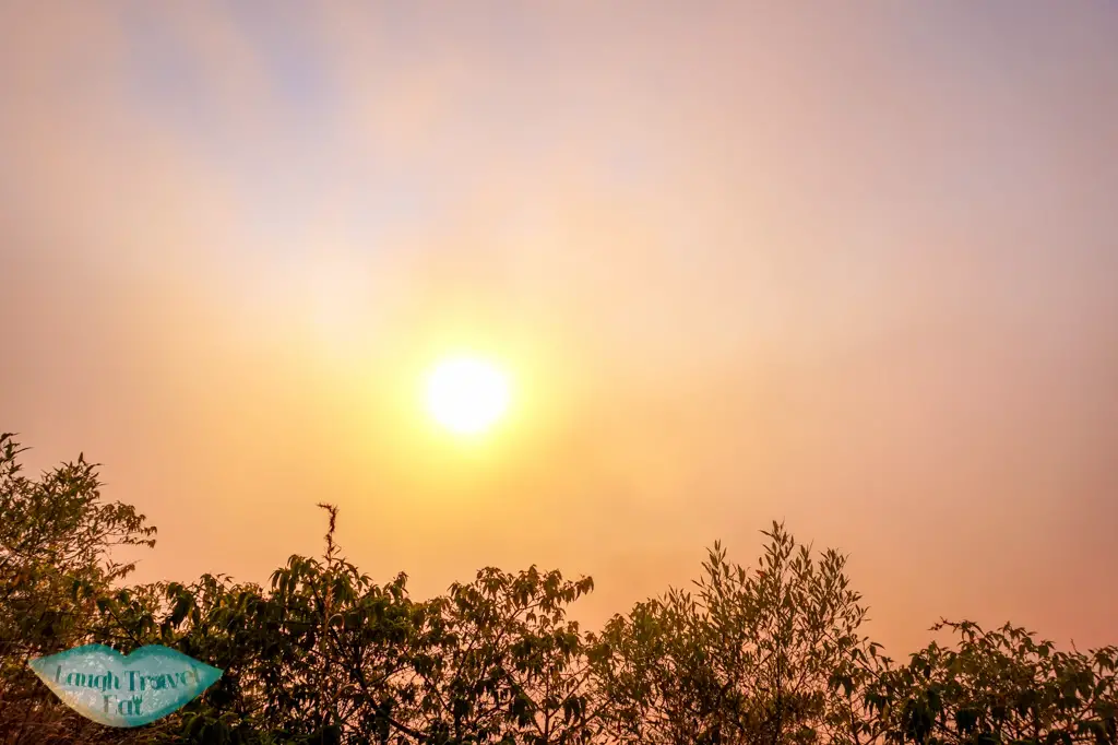 sunrise behind clouds Mount Batur bali indonesia - laugh travel eat