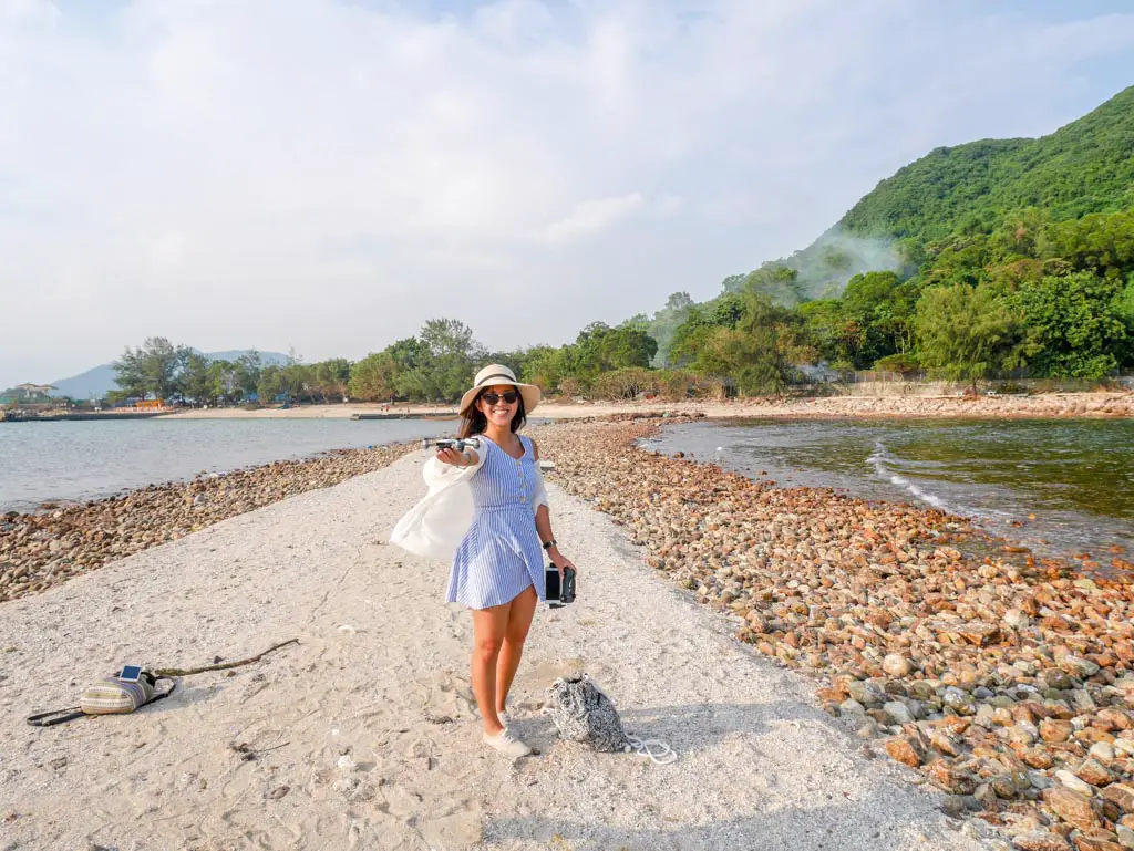 drone landing on my hand at sharp island sai kung hong kong - Laugh Travel Eat