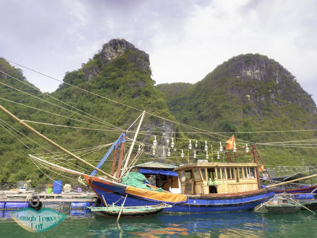 boat-with-kerosene-lamps-in-Cua-Van-Floating-village-on-bamboo-boats-paradise-elegance-halong-bay-vietnam-laugh-travel-eat