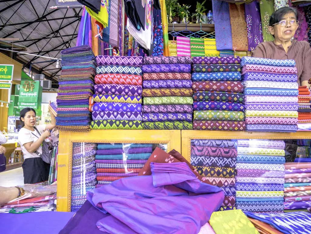 longyis sold in bogyoke aung san market yangon myanmar - laugh travel eat