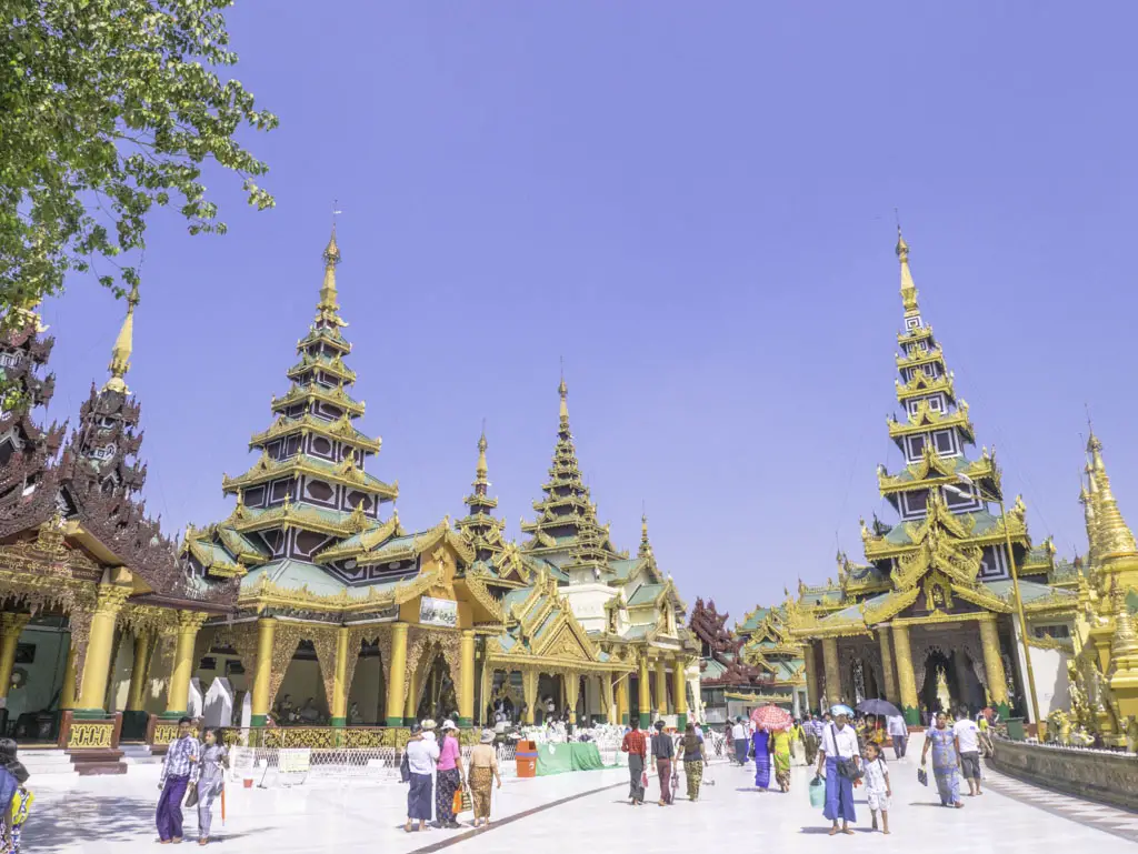 prayer halls in shwedagon pagoda yangon myanmar - laugh travel eat
