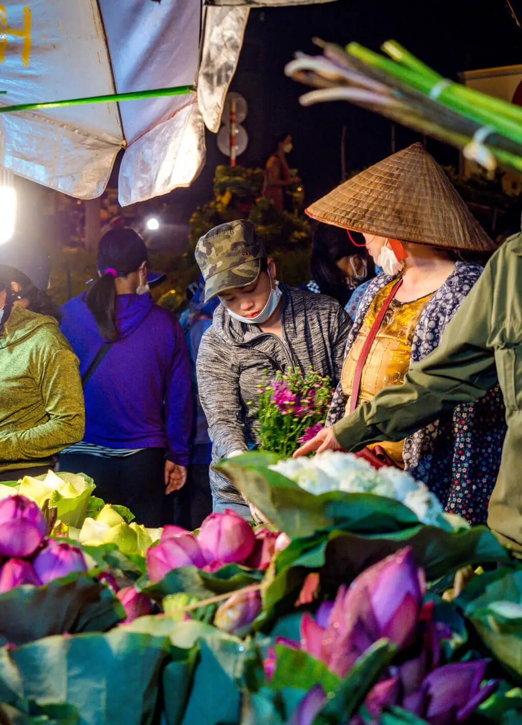 ladies at the flower market a chef's tour Hanoi Vietnam - laugh travel eat
