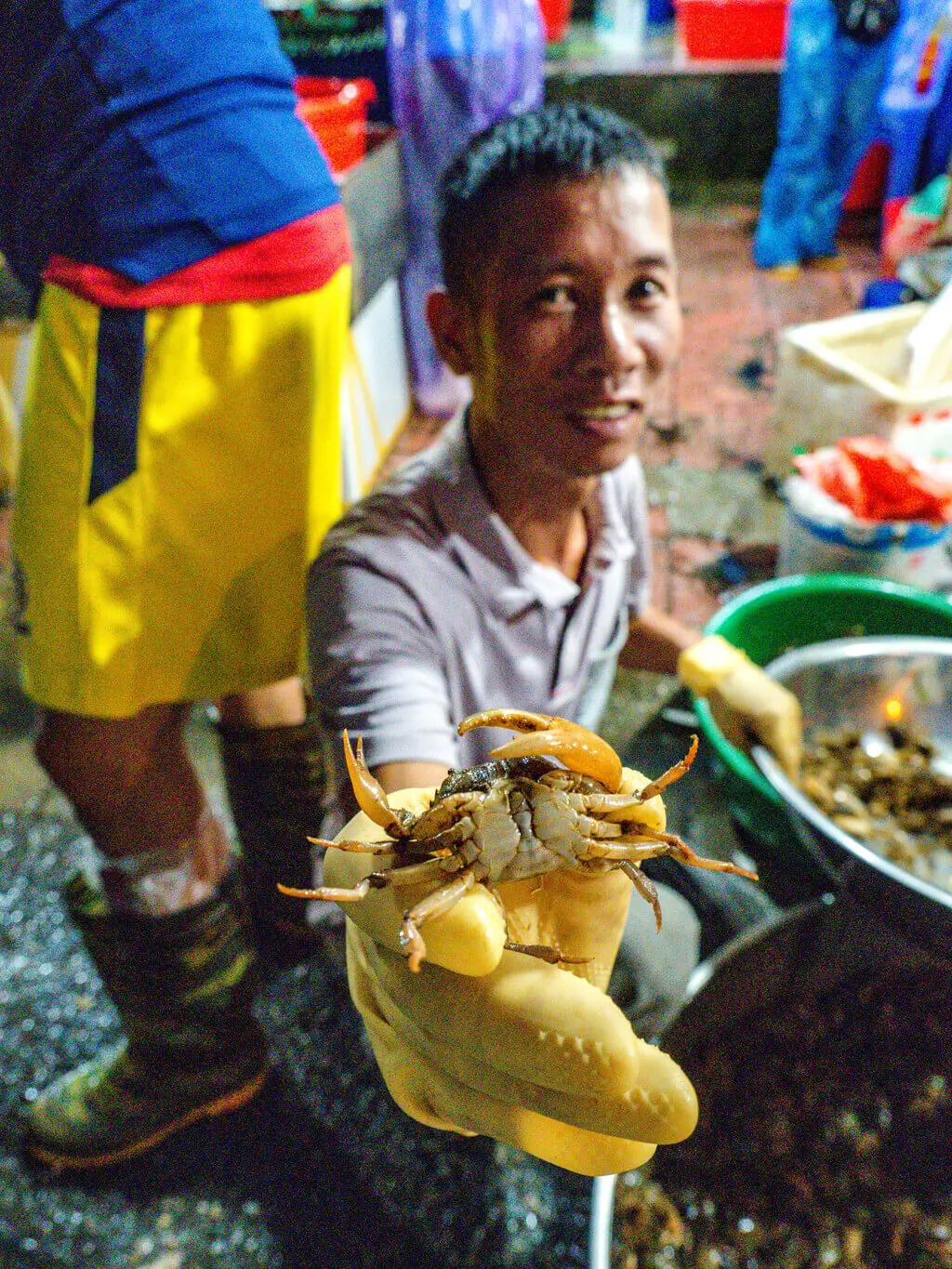 man with crab wholesale market a chef's tour Hanoi Vietnam - laugh travel eat