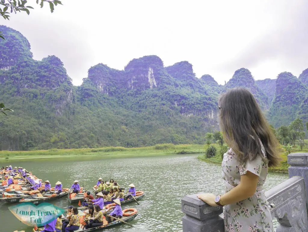 on-a-bridge-at-trang-an-grottoes-ninh-binh-vietnam-Laugh-Travel-Eat