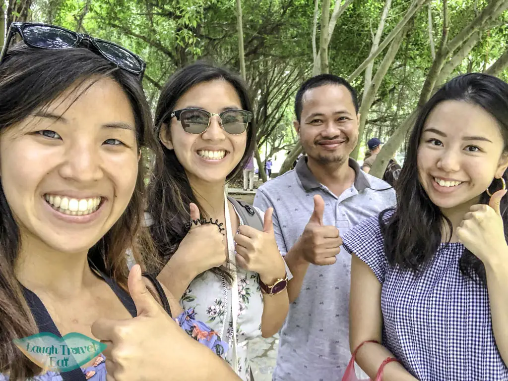 photo-with-our-vietnamese-dad-at-trang-an-grottoes-ninh-binh-vietnam-Laugh-Travel-Eat
