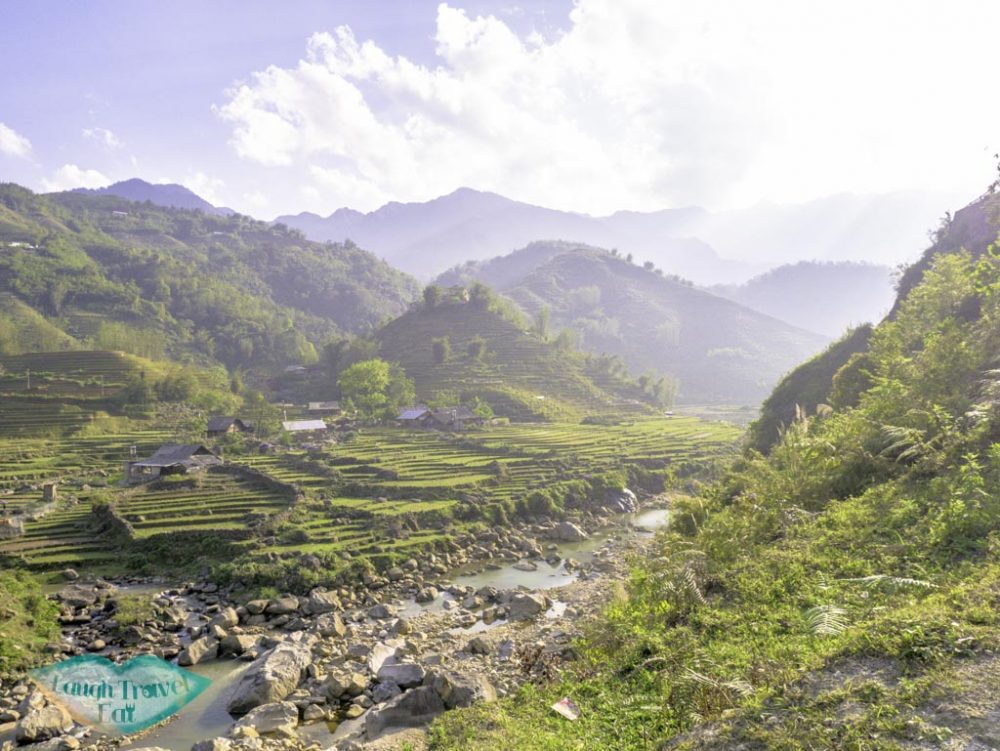 rice-paddies-with-strewam-on-our-trek-sapa-northern-vietnam-laugh-travel-eat