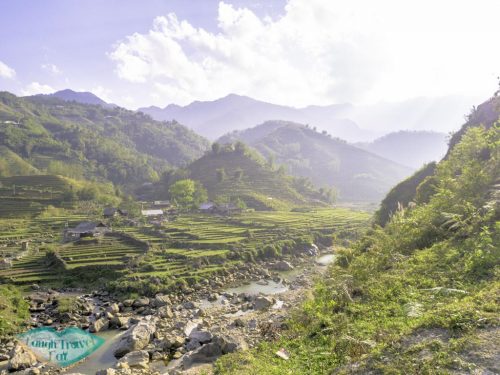 rice-paddies-with-strewam-on-our-trek-sapa-northern-vietnam-laugh-travel-eat