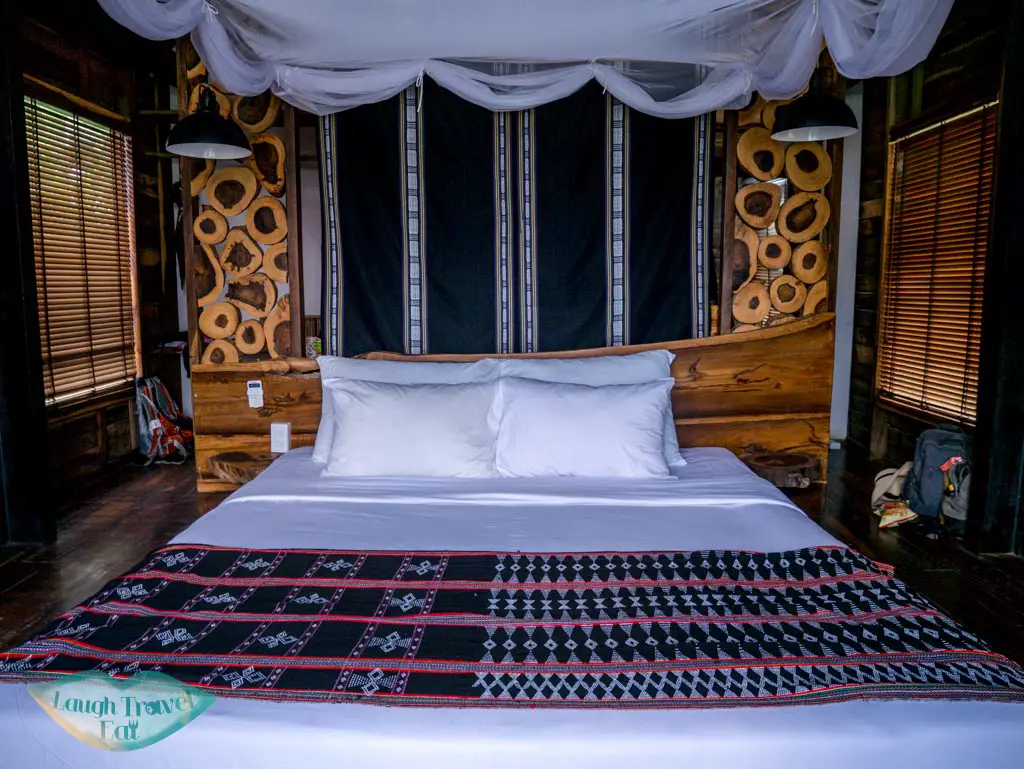 bed-in-bungalow-lak-tented-camp-dak-lak-vietnam-laugh-travel-eat