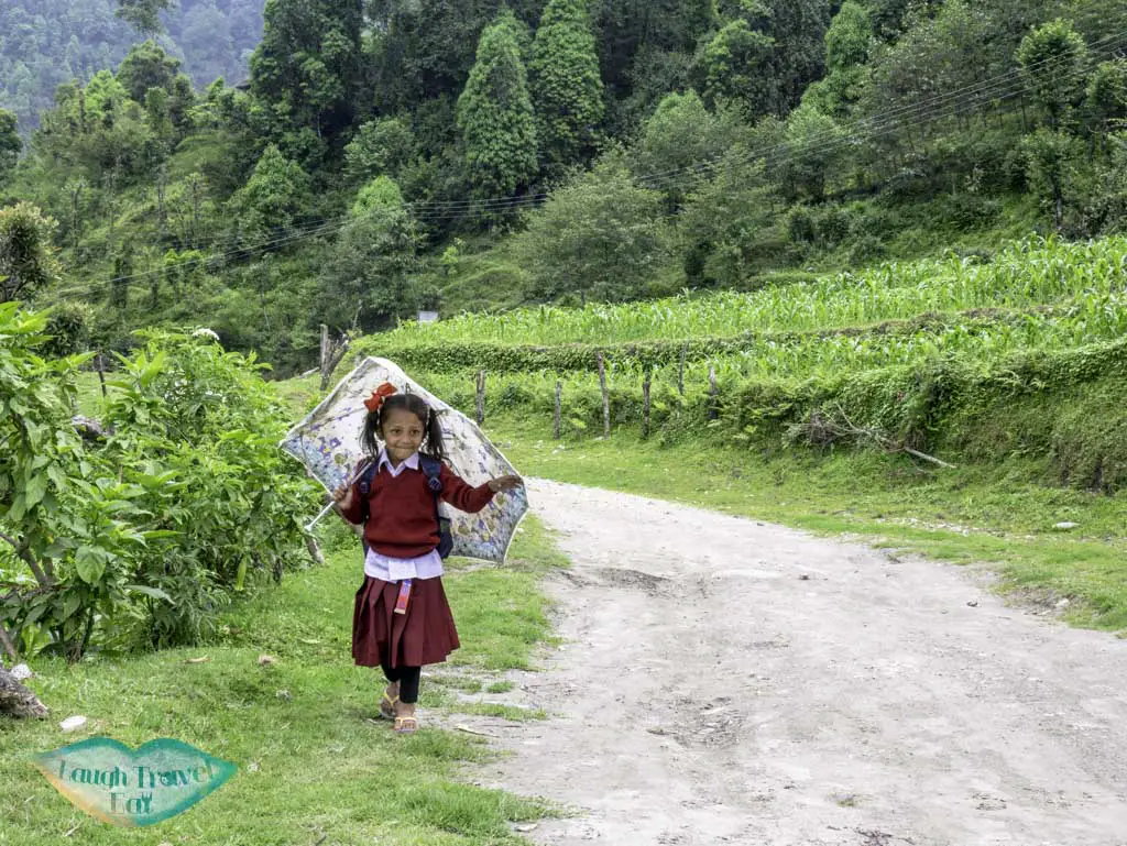 cute-school-girl-Poon-Hill-Trek-Annapurna-Conservation-Area-Nepal-laugh-travel-eat