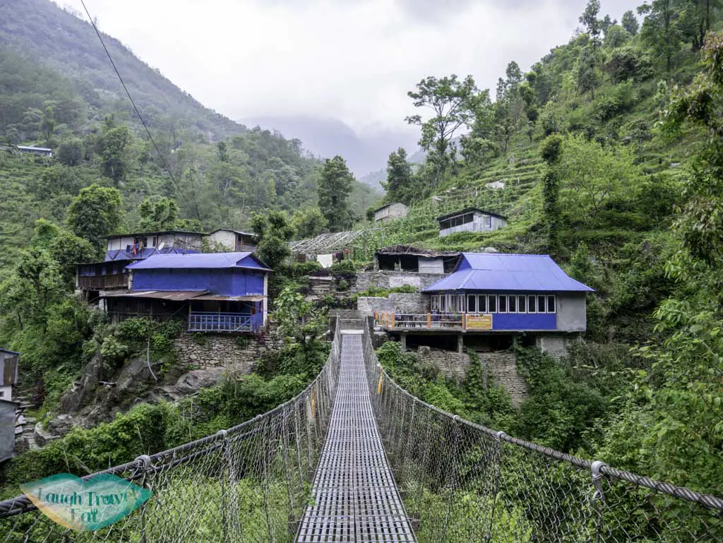 suspension-bridge-along-Poon-Hill-Trek-Annapurna-Conservation-Area-Nepal-laugh-travel-eat