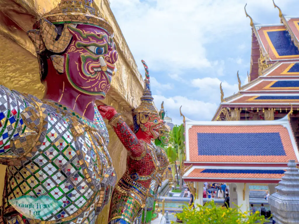 The-Royal-Pantheon-stupa-held-up-by-demons-grand-palace-entrance-bangkok-Thailand-laugh-travel-eat
