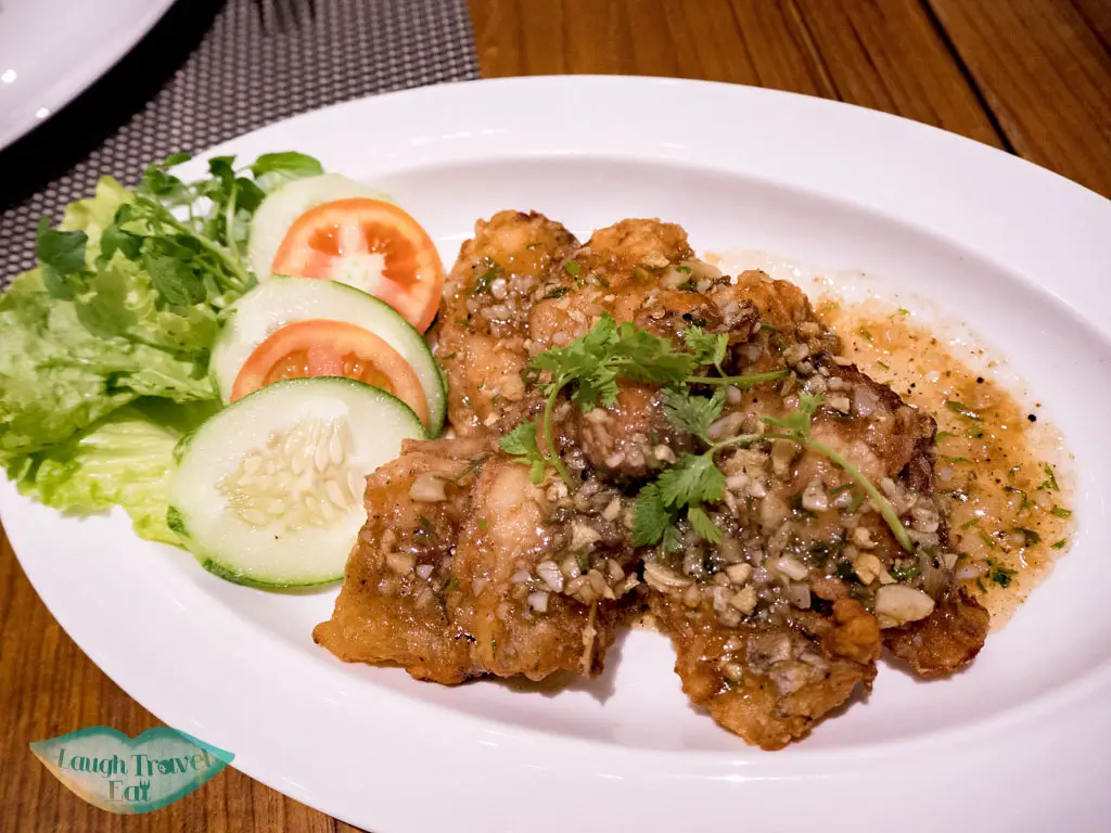 galanga stir fried fish with garlic pullman luang prabang laos - laugh travel eat