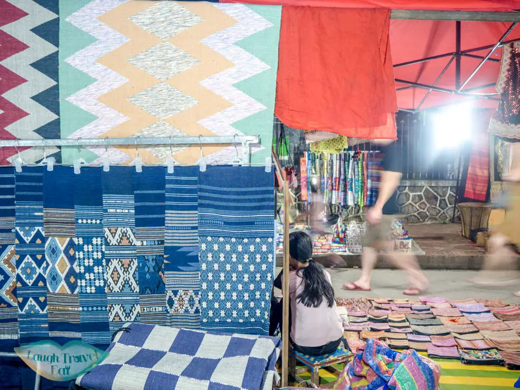 textile at night market luang prabang laos - laugh travel eat