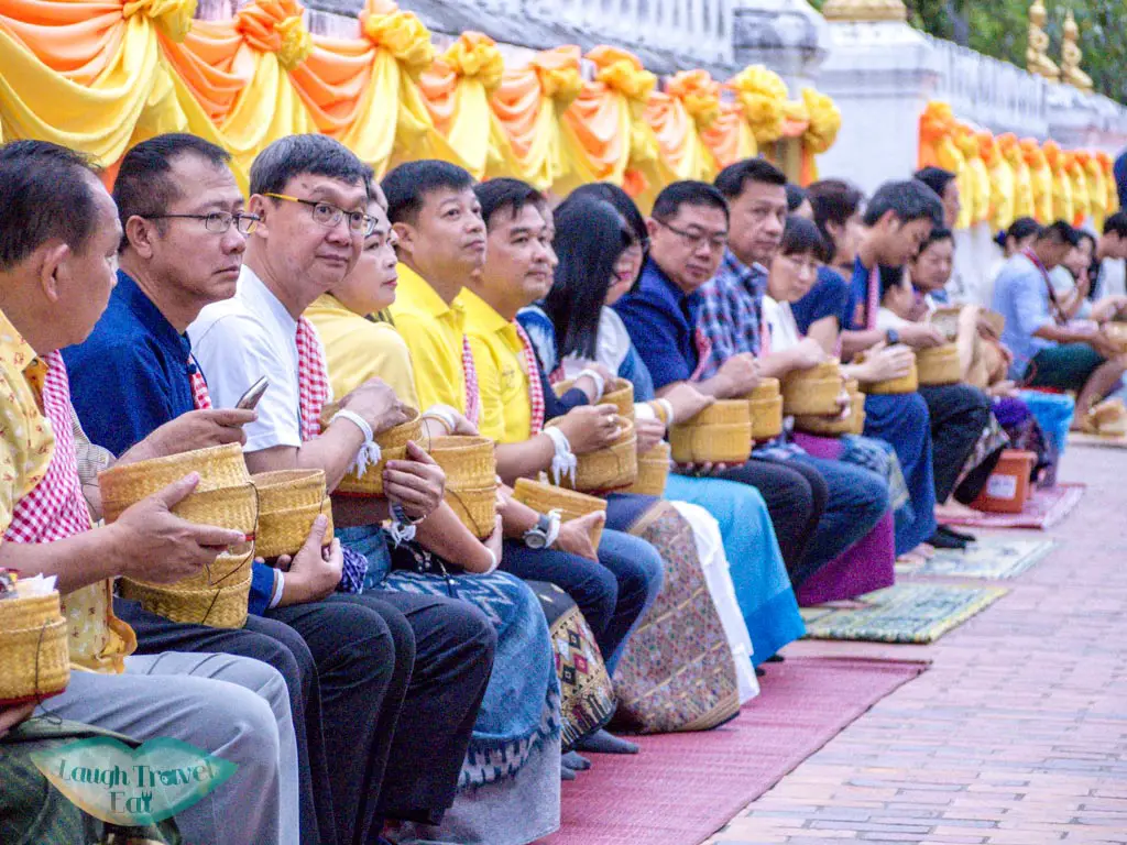 waiting for the alms giving ceremony luang prabang laos - laugh travel eat