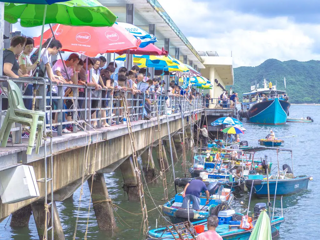 fisherman-selling-catch-by-pier-sai-kung-hong-kong-Laugh-Travel-Eat