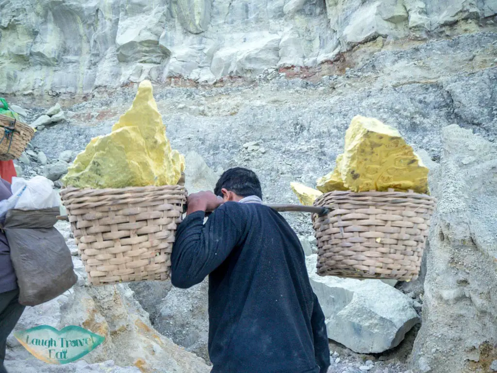 sulfur-miners-carrying-sulfur-out-of-crater-kawah-ijen-java-indonesia-laugh-travel-eat