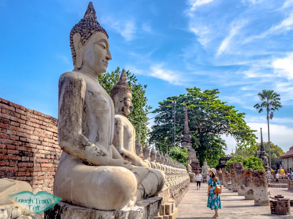 buddha-statues-and-pillars-Wat-Yai-Chai-Mongkhon-ayutthaya-thailand-laugh-travel-eat
