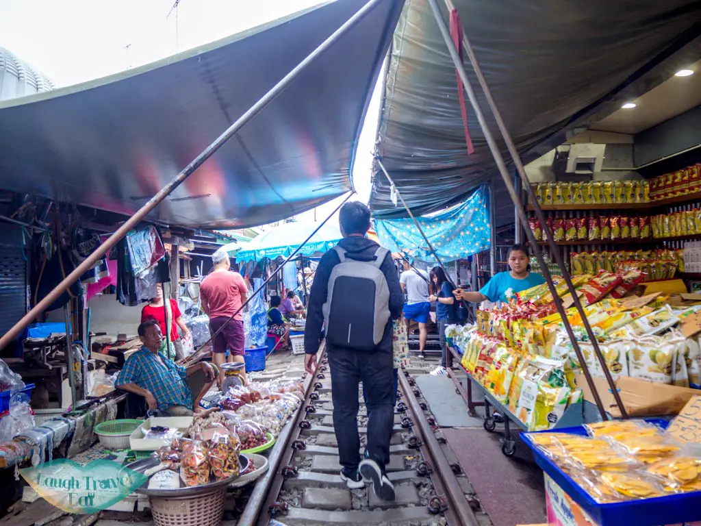 walking-in-the-maeklong-railway-market-bangkok-thailand-laugh-travel-eat