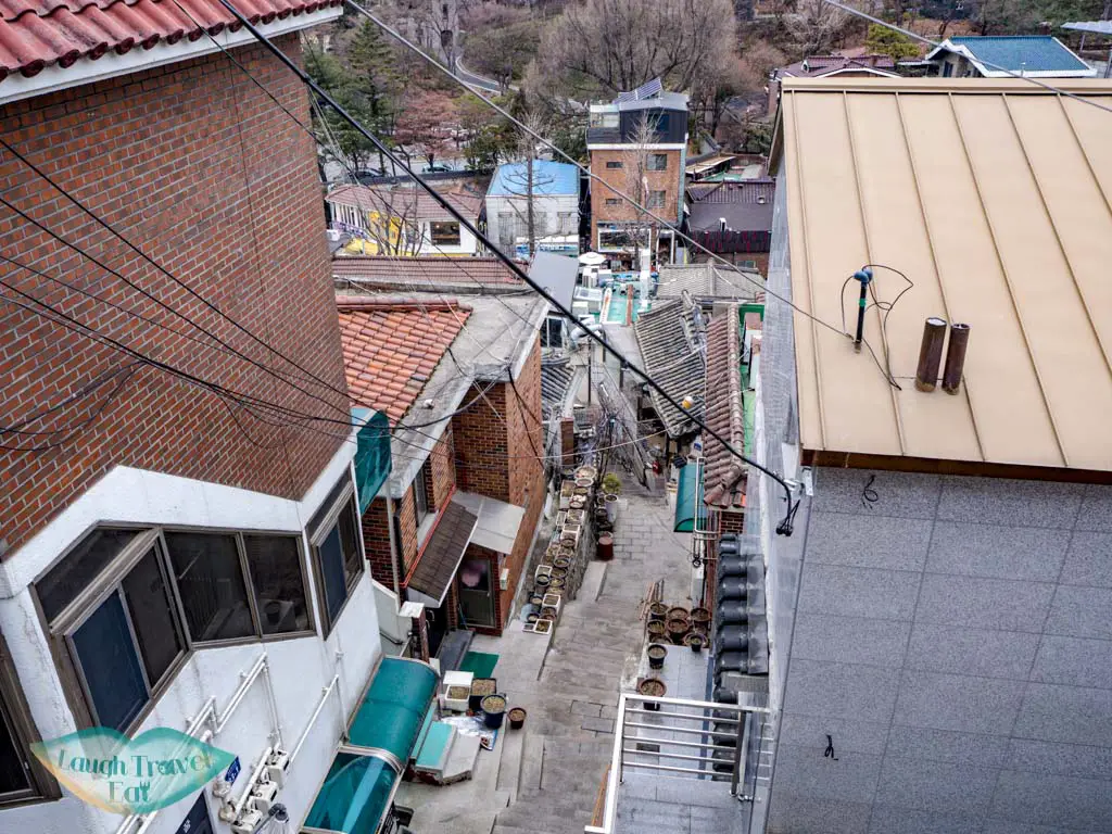 stairs-going-up-to-Bukchon-Hanok-Village-seoul-south-korea-laugh-travel-eat