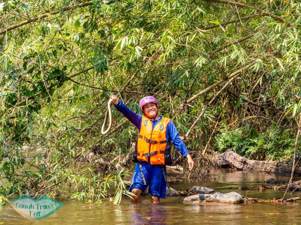 saiyung-with-snake-nam-ha-river-nam-ha-national-park-luang-namtha-laos-laugh-travel-eat